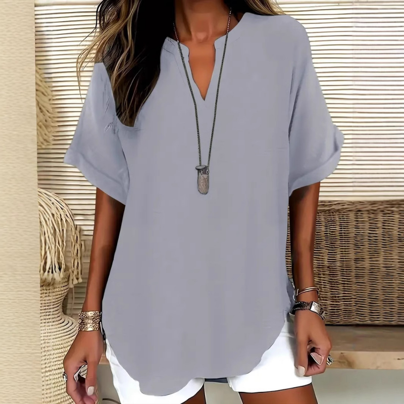 👚SCONTO DEL 60%! 🔥Top alla moda a maniche corte, ampio, con scollo a V profondo, orlo asimmetrico e tessuto leggero (5 colori, taglie dalla S alla 2XL) 🌸